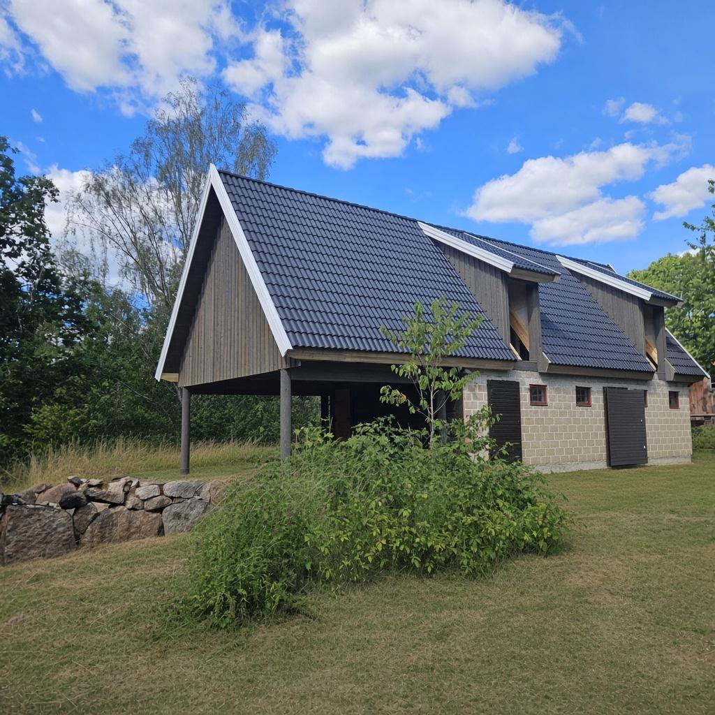 New outbuilding with black tiles on a natural stone wall