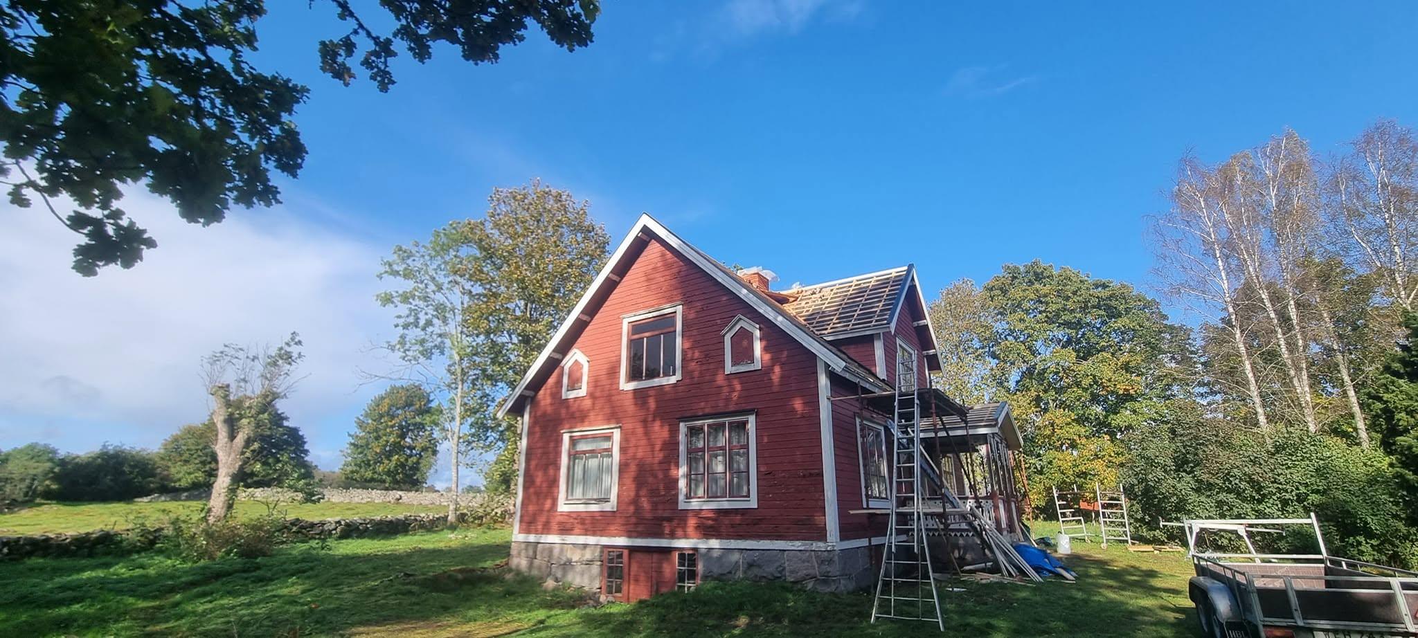 Older house with the roof stripped to the battens